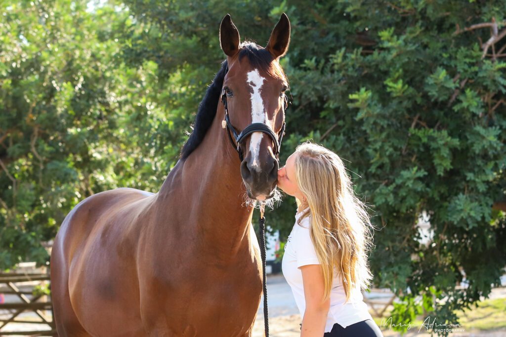 Beautiful blond girl with horse