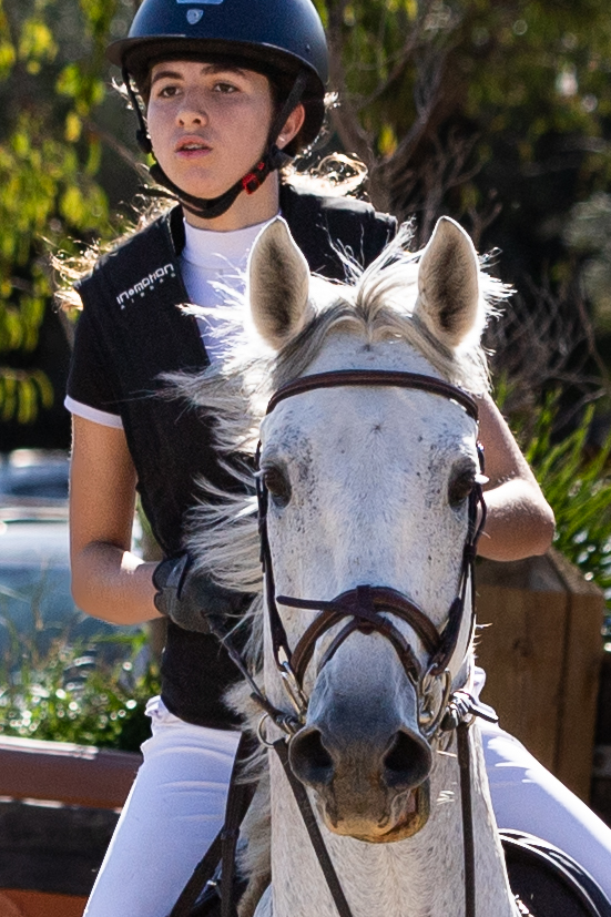 Girl on white horse